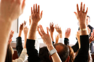 hands raised to ask a question